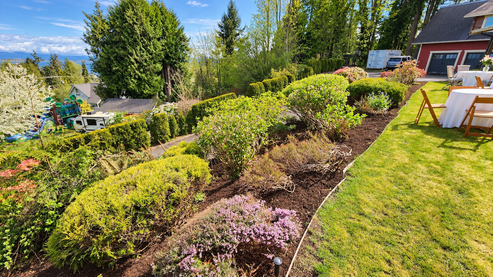 Mulched garden beds along a neatly defined lawn edge